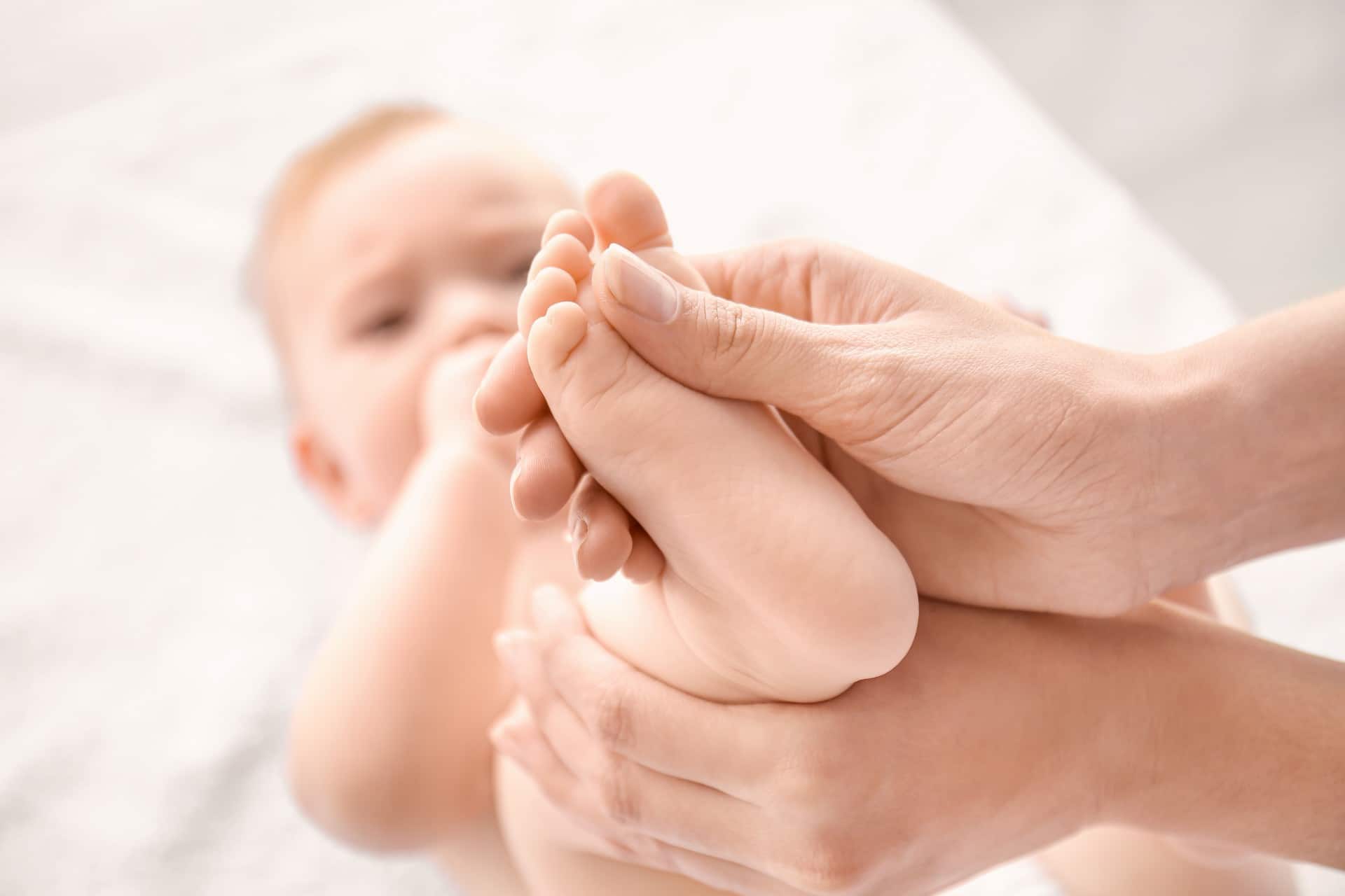 someone checking on a baby's foot